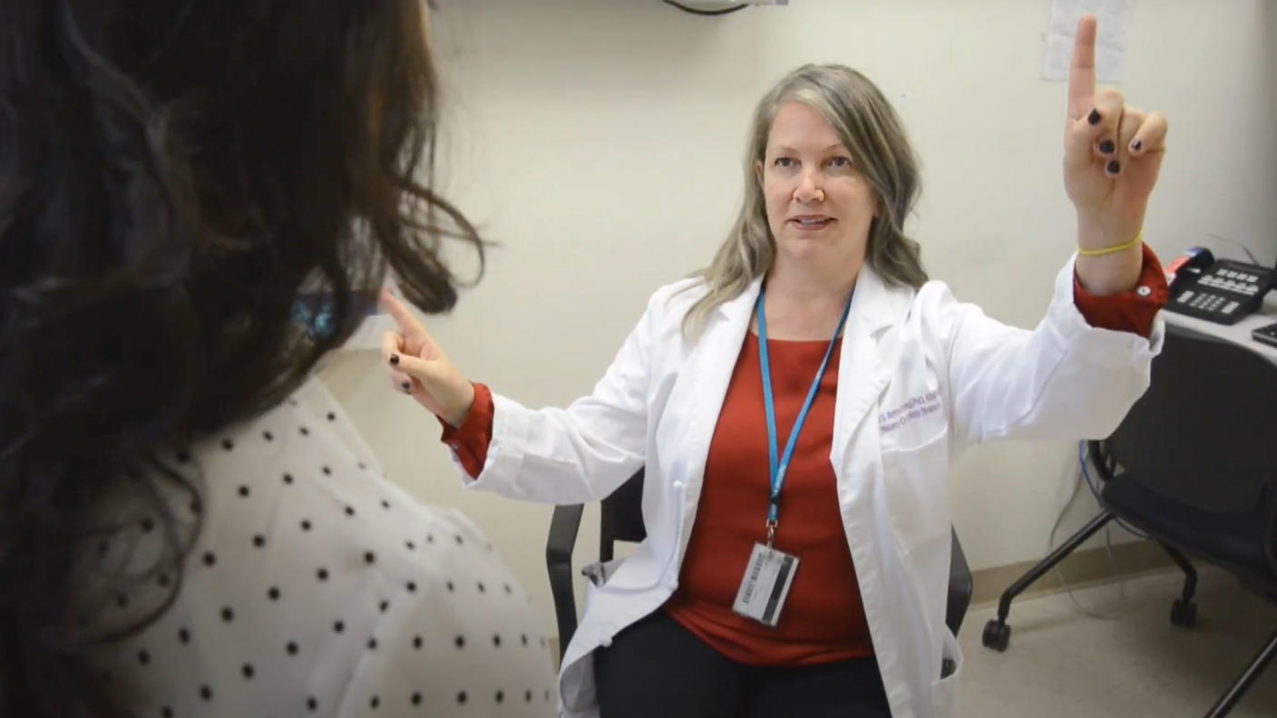 Dr. Armstrong conducts a cognitive assessment with a patient